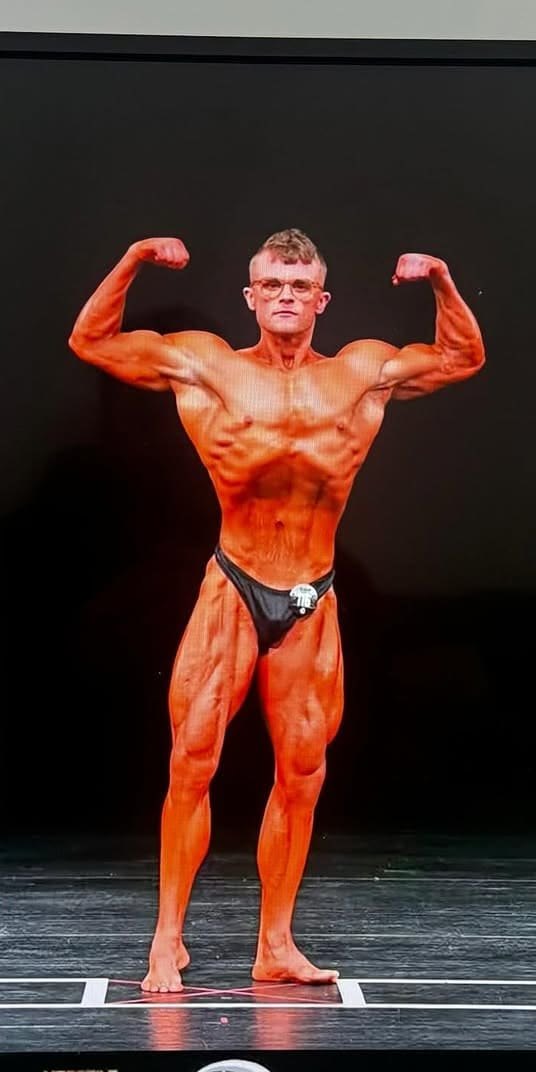A ProFlow client in a hooded top at the start, and later on a competition stage.